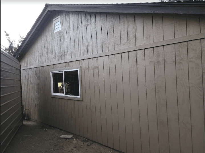Side of a home with newly installed siding